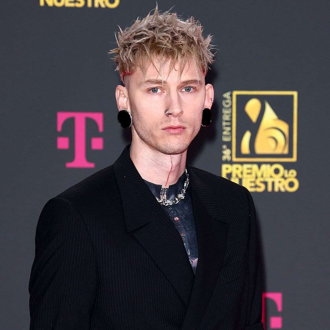 Machine Gun Kelly Puts His Black Ink Tattoos, Man Bun On Full Display